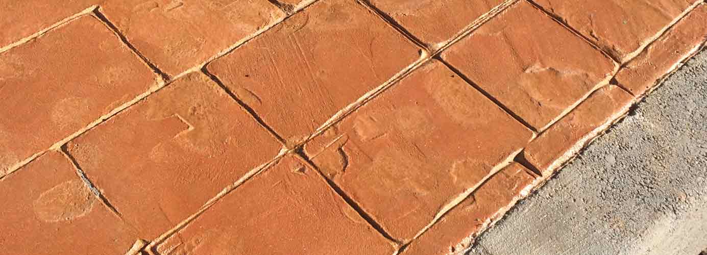 suelo de hormign impreso simil adoqun anaranjado